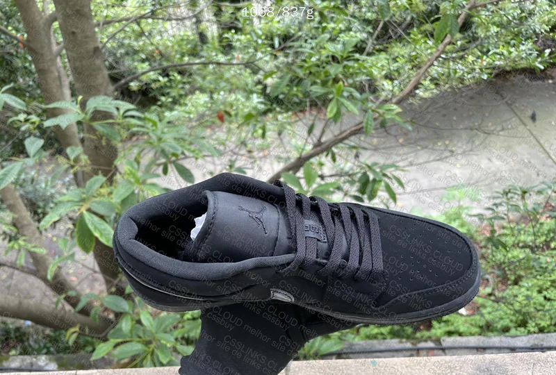 AJ1 TRIPLE BLACK IN NATURAL LIGHT 2