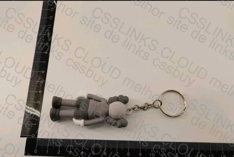 Off-White Keychain and KAWS Figurine 2