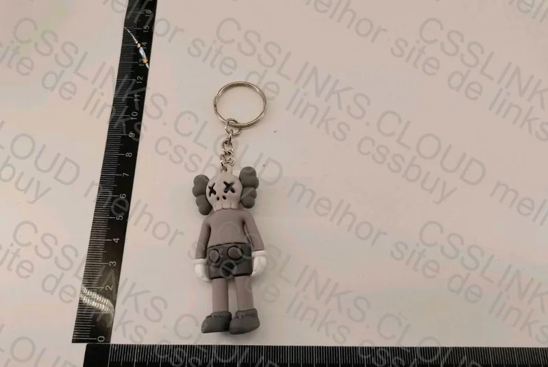 Off-White Keychain and KAWS Figurine 3